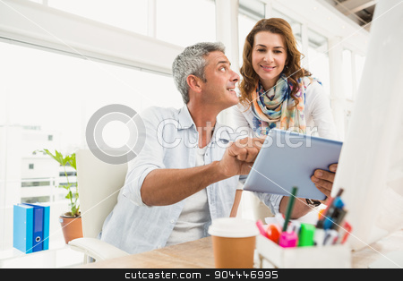 To use this stock image in your creative project, please select the size you need over to the right and click the "Add to Cart" button.
Your downloaded image will come with the Cutcaster watermark removed so don’t worry about the watermark you see on this page. Two casual designers working with tablet stock photo, Two casual designers working with tablet in the office by Wavebreak Media