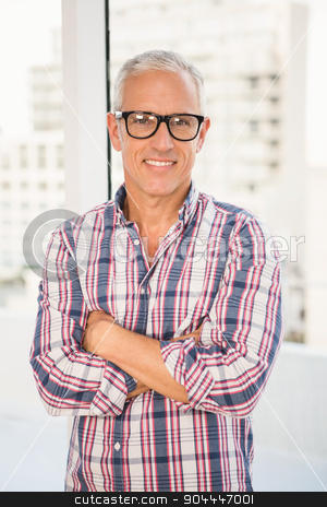 To use this stock image in your creative project, please select the size you need over to the right and click the "Add to Cart" button.
Your downloaded image will come with the Cutcaster watermark removed so don’t worry about the watermark you see on this page. Smiling casual businessman with arms crossed stock photo, Portrait of smiling casual businessman with arms crossed in the office by Wavebreak Media