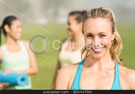 To use this stock image in your creative project, please select the size you need over to the right and click the "Add to Cart" button.
Your downloaded image will come with the Cutcaster watermark removed so don’t worry about the watermark you see on this page. Smiling sporty blonde in front of friends stock photo, Portrait of smiling sporty blonde in front of friends in parkland by Wavebreak Media