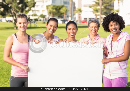 To use this stock image in your creative project, please select the size you need over to the right and click the "Add to Cart" button.
Your downloaded image will come with the Cutcaster watermark removed so don’t worry about the watermark you see on this page. Women wearing pink for breast cancer and holding blank poster stock photo, Portrait of women wearing pink for breast cancer and holding blank poster in parkland by Wavebreak Media