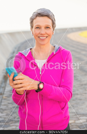 To use this stock image in your creative project, please select the size you need over to the right and click the "Add to Cart" button.
Your downloaded image will come with the Cutcaster watermark removed so don’t worry about the watermark you see on this page. Smiling sporty woman enjoying music and holding phone stock photo, Portrait of smiling sporty woman enjoying music and holding phone at promenade by Wavebreak Media