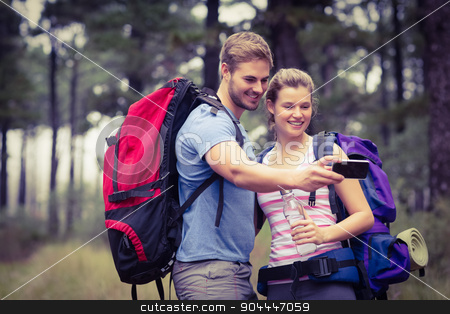 To use this stock image in your creative project, please select the size you need over to the right and click the "Add to Cart" button.
Your downloaded image will come with the Cutcaster watermark removed so don’t worry about the watermark you see on this page. Young happy couple hiking in the nature stock photo, Young happy couple hiking in the nature and taking a selfie by Wavebreak Media