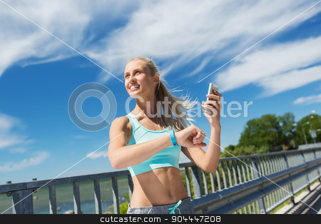 To use this stock image in your creative project, please select the size you need over to the right and click the "Add to Cart" button.
Your downloaded image will come with the Cutcaster watermark removed so don’t worry about the watermark you see on this page. happy woman with heart rate watch and smartphone stock photo, fitness, sport, people, technology and healthy lifestyle concept - smiling young woman with heart rate watch and smartphone exercising outdoors by Syda Productions