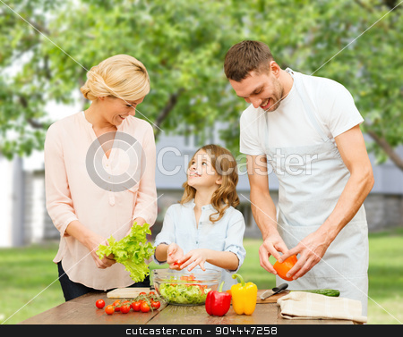 To use this stock image in your creative project, please select the size you need over to the right and click the "Add to Cart" button.
Your downloaded image will come with the Cutcaster watermark removed so don’t worry about the watermark you see on this page. happy family cooking vegetable salad for dinner stock photo, vegetarian food, culinary, happiness and people concept - happy family cooking vegetable salad for dinner over over summer house background by Syda Productions