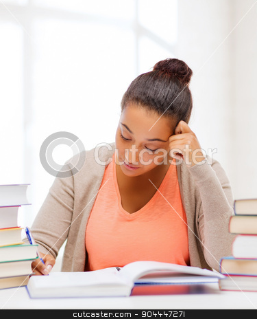 To use this stock image in your creative project, please select the size you need over to the right and click the "Add to Cart" button.
Your downloaded image will come with the Cutcaster watermark removed so don’t worry about the watermark you see on this page. international student studying in college stock photo, education and business concept - international student studying in college by Syda Productions