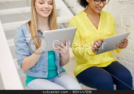 To use this stock image in your creative project, please select the size you need over to the right and click the "Add to Cart" button.
Your downloaded image will come with the Cutcaster watermark removed so don’t worry about the watermark you see on this page. close up of students with tablet pc at school stock photo, education, technology, people and internet concept - close up of smiling students with tablet pc computers at school by Syda Productions