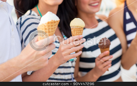 To use this stock image in your creative project, please select the size you need over to the right and click the "Add to Cart" button.
Your downloaded image will come with the Cutcaster watermark removed so don’t worry about the watermark you see on this page. close up of happy friends eating ice cream stock photo, friendship, leisure, sweets, summer and people concept - close up of happy friends eating ice cream outdoors by Syda Productions