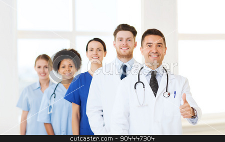 To use this stock image in your creative project, please select the size you need over to the right and click the "Add to Cart" button.
Your downloaded image will come with the Cutcaster watermark removed so don’t worry about the watermark you see on this page. group of happy doctors at hospital stock photo, hospital, profession, people and medicine concept - group of happy doctors at hospital showing thumbs up gesture by Syda Productions