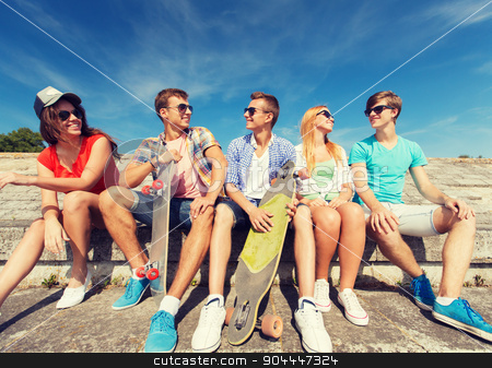 To use this stock image in your creative project, please select the size you need over to the right and click the "Add to Cart" button.
Your downloaded image will come with the Cutcaster watermark removed so don’t worry about the watermark you see on this page. group of smiling friends sitting on city street stock photo, friendship, leisure, summer and people concept - group of smiling friends with skateboards sitting on city street by Syda Productions