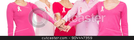 To use this stock image in your creative project, please select the size you need over to the right and click the "Add to Cart" button.
Your downloaded image will come with the Cutcaster watermark removed so don’t worry about the watermark you see on this page. close up of women with cancer awareness ribbons stock photo, healthcare, people, gesture and medicine concept - close up of women in blank shirts with pink breast cancer awareness ribbons putting hands on top over white background by Syda Productions