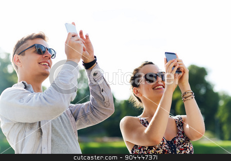 To use this stock image in your creative project, please select the size you need over to the right and click the "Add to Cart" button.
Your downloaded image will come with the Cutcaster watermark removed so don’t worry about the watermark you see on this page. smiling friends with smartphone taking picture stock photo, friendship, leisure, summer, technology and people concept - group of smiling friends with smartphone taking picture outdoors by Syda Productions