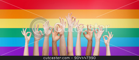 To use this stock image in your creative project, please select the size you need over to the right and click the "Add to Cart" button.
Your downloaded image will come with the Cutcaster watermark removed so don’t worry about the watermark you see on this page. hands showing ok sign over rainbow background stock photo, people, gay pride, gesture and homosexual concept - human hands showing ok sign over rainbow flag stripes background by Syda Productions