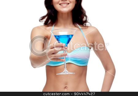 To use this stock image in your creative project, please select the size you need over to the right and click the "Add to Cart" button.
Your downloaded image will come with the Cutcaster watermark removed so don’t worry about the watermark you see on this page. happy young woman in swimsuit drinking cocktail stock photo, people, summer holidays, celebration, drinks and beach concept - happy young woman in bikini swimsuit drinking cocktail at party by Syda Productions