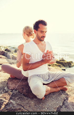 To use this stock image in your creative project, please select the size you need over to the right and click the "Add to Cart" button.
Your downloaded image will come with the Cutcaster watermark removed so don’t worry about the watermark you see on this page. smiling couple making yoga exercises outdoors stock photo, fitness, sport, friendship and lifestyle concept - smiling couple making yoga exercises sitting outdoors by Syda Productions