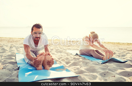 To use this stock image in your creative project, please select the size you need over to the right and click the "Add to Cart" button.
Your downloaded image will come with the Cutcaster watermark removed so don’t worry about the watermark you see on this page. couple making yoga exercises outdoors stock photo, fitness, sport, friendship and lifestyle concept - couple making yoga exercises sitting on mats outdoors by Syda Productions
