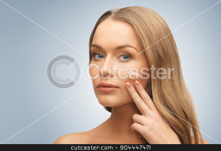 To use this stock image in your creative project, please select the size you need over to the right and click the "Add to Cart" button.
Your downloaded image will come with the Cutcaster watermark removed so don’t worry about the watermark you see on this page. woman with pale and dark foundation tone on face stock photo, people, beauty, cosmetics and makeup concept - beautiful woman applying pale and dark foundation tone to face over gray background by Syda Productions