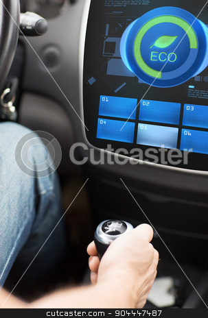 To use this stock image in your creative project, please select the size you need over to the right and click the "Add to Cart" button.
Your downloaded image will come with the Cutcaster watermark removed so don’t worry about the watermark you see on this page. hand with gearshift and car eco mode on screen stock photo, transport, modern, green energy, technology and people concept - male hand on gearshift and car eco system mode on screen by Syda Productions