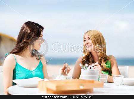 To use this stock image in your creative project, please select the size you need over to the right and click the "Add to Cart" button.
Your downloaded image will come with the Cutcaster watermark removed so don’t worry about the watermark you see on this page. girls in cafe on the beach stock photo, summer holidays and vacation - girls in cafe on the beach by Syda Productions