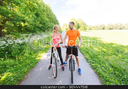 To use this stock image in your creative project, please select the size you need over to the right and click the "Add to Cart" button.
Your downloaded image will come with the Cutcaster watermark removed so don’t worry about the watermark you see on this page. happy couple riding bicycle outdoors stock photo, fitness, sport, people and healthy lifestyle concept - happy couple riding bicycle outdoors at summer by Syda Productions