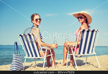 To use this stock image in your creative project, please select the size you need over to the right and click the "Add to Cart" button.
Your downloaded image will come with the Cutcaster watermark removed so don’t worry about the watermark you see on this page. happy women sunbathing in lounges on beach stock photo, summer vacation, travel and people concept - happy women drinking beer and sunbathing in lounges on beach by Syda Productions
