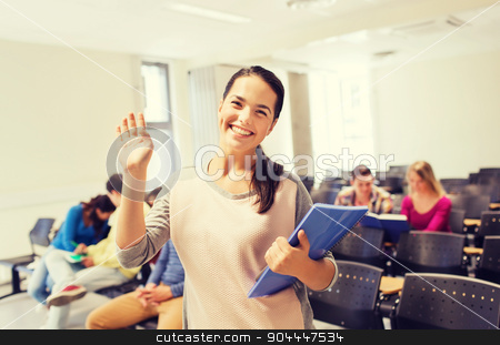 To use this stock image in your creative project, please select the size you need over to the right and click the "Add to Cart" button.
Your downloaded image will come with the Cutcaster watermark removed so don’t worry about the watermark you see on this page. group of smiling students in lecture hall stock photo, education, high school, gesture, teamwork and people concept - group of smiling students with notepads waving hand in lecture hall by Syda Productions