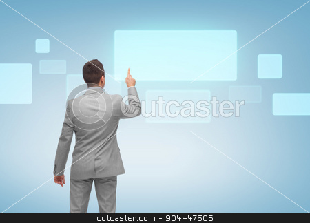 To use this stock image in your creative project, please select the size you need over to the right and click the "Add to Cart" button.
Your downloaded image will come with the Cutcaster watermark removed so don’t worry about the watermark you see on this page. businessman pointing finger to virtual screen stock photo, business, people, advertisement and technology concept - businessman pointing finger or touching blank virtual screen over blue background from back by Syda Productions