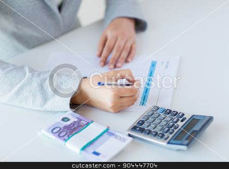 To use this stock image in your creative project, please select the size you need over to the right and click the "Add to Cart" button.
Your downloaded image will come with the Cutcaster watermark removed so don’t worry about the watermark you see on this page. close up of hands counting money with calculator stock photo, business, finance, tax and people concept - close up of woman hands counting euro money with calculator and tax report form by Syda Productions