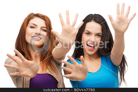 To use this stock image in your creative project, please select the size you need over to the right and click the "Add to Cart" button.
Your downloaded image will come with the Cutcaster watermark removed so don’t worry about the watermark you see on this page. two smiling girls showing their palms stock photo, happiness and people concept - two smiling girls showing their palms by Syda Productions