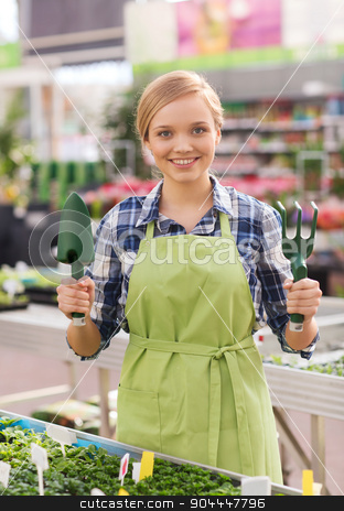 To use this stock image in your creative project, please select the size you need over to the right and click the "Add to Cart" button.
Your downloaded image will come with the Cutcaster watermark removed so don’t worry about the watermark you see on this page. happy woman with gardening tools in greenhouse stock photo, people, gardening tools and profession concept - happy woman or gardener with trowel and fork in greenhouse by Syda Productions