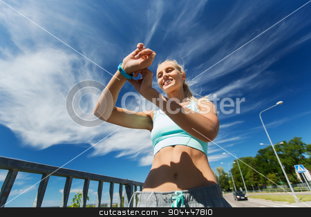 To use this stock image in your creative project, please select the size you need over to the right and click the "Add to Cart" button.
Your downloaded image will come with the Cutcaster watermark removed so don’t worry about the watermark you see on this page. happy woman with heart rate watch and earphones stock photo, fitness, sport, people, technology and healthy lifestyle concept - smiling young woman with heart rate watch and earphones exercising outdoors by Syda Productions