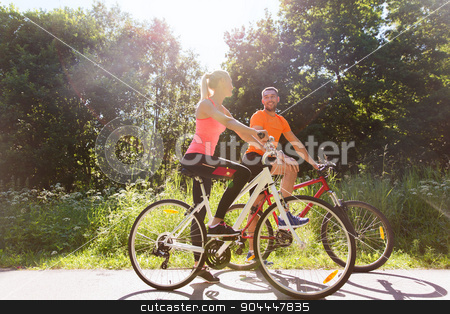 To use this stock image in your creative project, please select the size you need over to the right and click the "Add to Cart" button.
Your downloaded image will come with the Cutcaster watermark removed so don’t worry about the watermark you see on this page. happy couple riding bicycle outdoors stock photo, fitness, sport, people and healthy lifestyle concept - happy couple riding bicycle outdoors at summer by Syda Productions