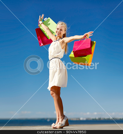 To use this stock image in your creative project, please select the size you need over to the right and click the "Add to Cart" button.
Your downloaded image will come with the Cutcaster watermark removed so don’t worry about the watermark you see on this page. smiling woman with shopping bag rising hands stock photo, consumerism, sale and people concept - smiling woman with shopping bag rising hands by Syda Productions