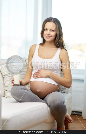 To use this stock image in your creative project, please select the size you need over to the right and click the "Add to Cart" button.
Your downloaded image will come with the Cutcaster watermark removed so don’t worry about the watermark you see on this page. happy pregnant woman drinking milk at home stock photo, pregnancy, drinks, healthy eating, people and expectation concept - happy pregnant woman drinking milk from glass at home by Syda Productions