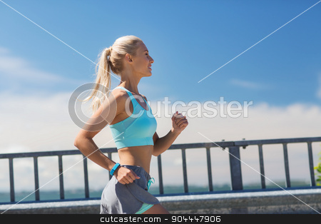 To use this stock image in your creative project, please select the size you need over to the right and click the "Add to Cart" button.
Your downloaded image will come with the Cutcaster watermark removed so don’t worry about the watermark you see on this page. smiling young woman running outdoors stock photo, fitness, sport, people and healthy lifestyle concept - smiling young woman with heart rate watch running outdoors by Syda Productions