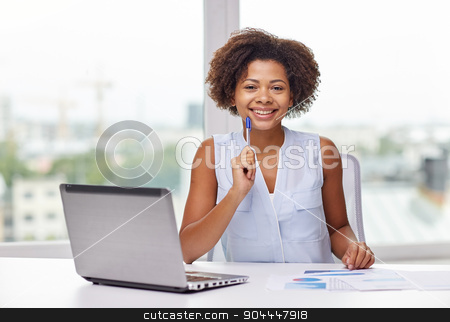 To use this stock image in your creative project, please select the size you need over to the right and click the "Add to Cart" button.
Your downloaded image will come with the Cutcaster watermark removed so don’t worry about the watermark you see on this page. happy african woman with laptop at office stock photo, education, business and technology concept - happy african american businesswoman or student with laptop computer and papers at office by Syda Productions