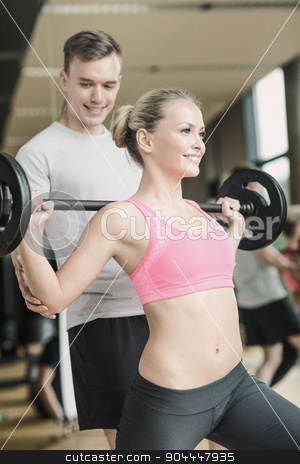 To use this stock image in your creative project, please select the size you need over to the right and click the "Add to Cart" button.
Your downloaded image will come with the Cutcaster watermark removed so don’t worry about the watermark you see on this page. smiling man and woman with barbell in gym stock photo, sport, fitness, lifestyle and people concept - smiling man and woman with barbell exercising in gym by Syda Productions