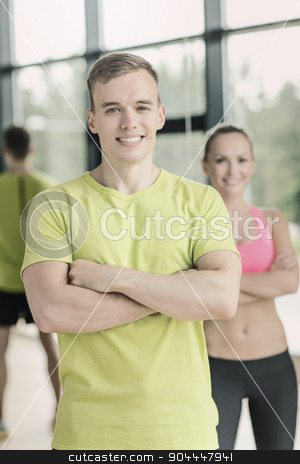 To use this stock image in your creative project, please select the size you need over to the right and click the "Add to Cart" button.
Your downloaded image will come with the Cutcaster watermark removed so don’t worry about the watermark you see on this page. smiling man and woman in gym stock photo, sport, fitness, lifestyle and people concept - smiling man and woman in gym by Syda Productions