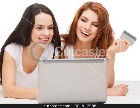 To use this stock image in your creative project, please select the size you need over to the right and click the "Add to Cart" button.
Your downloaded image will come with the Cutcaster watermark removed so don’t worry about the watermark you see on this page. two smiling teenagers with laptop and credit card stock photo, online shopping and technology concept - two smiling teenage girls with laptop computer and credit card by Syda Productions