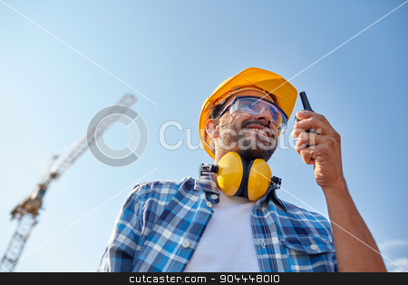 To use this stock image in your creative project, please select the size you need over to the right and click the "Add to Cart" button.
Your downloaded image will come with the Cutcaster watermark removed so don’t worry about the watermark you see on this page. builder in hardhat with walkie talkie stock photo, industry, building, technology and people concept - male builder in hardhat with walkie talkie or radio outdoors by Syda Productions