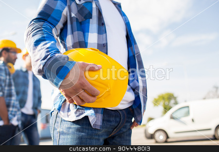 To use this stock image in your creative project, please select the size you need over to the right and click the "Add to Cart" button.
Your downloaded image will come with the Cutcaster watermark removed so don’t worry about the watermark you see on this page. close up of builder holding hardhat at building stock photo, building, protective gear and people concept - close up of builder hand holding yellow hardhat or helmet at construction site by Syda Productions