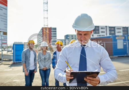 To use this stock image in your creative project, please select the size you need over to the right and click the "Add to Cart" button.
Your downloaded image will come with the Cutcaster watermark removed so don’t worry about the watermark you see on this page. happy builders and architect at construction site stock photo, business, building, teamwork and people concept - group of smiling builders and architect with clipboard in hardhats at construction site by Syda Productions