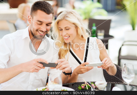 To use this stock image in your creative project, please select the size you need over to the right and click the "Add to Cart" button.
Your downloaded image will come with the Cutcaster watermark removed so don’t worry about the watermark you see on this page. happy couple with smatphone photographing food stock photo, love, date, technology, people and relations concept - happy couple with smatphone taking picture of food at restaurant by Syda Productions