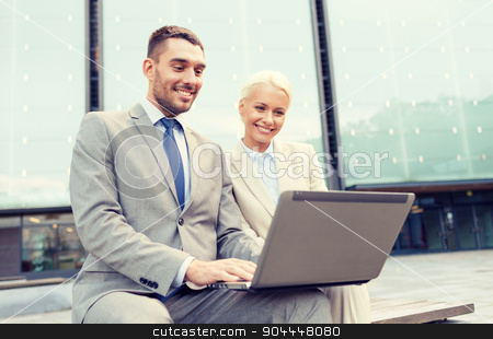 To use this stock image in your creative project, please select the size you need over to the right and click the "Add to Cart" button.
Your downloaded image will come with the Cutcaster watermark removed so don’t worry about the watermark you see on this page. smiling businesspeople with laptop outdoors stock photo, business, education, technology and people concept - smiling businesspeople working with laptop computer on city street by Syda Productions