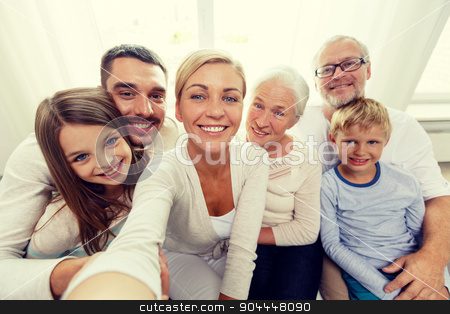 To use this stock image in your creative project, please select the size you need over to the right and click the "Add to Cart" button.
Your downloaded image will come with the Cutcaster watermark removed so don’t worry about the watermark you see on this page. happy family making selfie at home stock photo, family, happiness, generation and people concept - happy family sitting on couch and making self portrait with camera or smartphone at home by Syda Productions