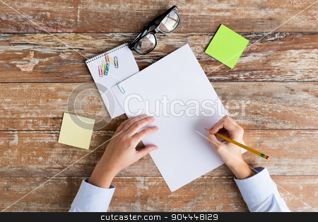 To use this stock image in your creative project, please select the size you need over to the right and click the "Add to Cart" button.
Your downloaded image will come with the Cutcaster watermark removed so don’t worry about the watermark you see on this page. close up of hands with papers and eyeglasses stock photo, business, education and people concept - close up of female hands with papers, stickers and eyeglasses on table by Syda Productions