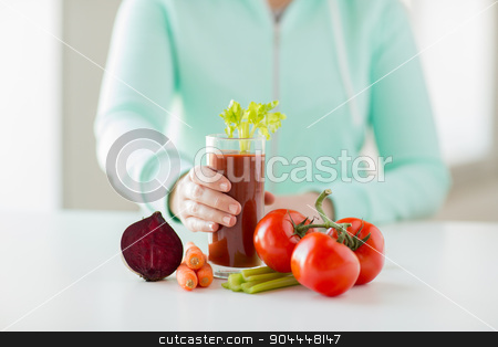To use this stock image in your creative project, please select the size you need over to the right and click the "Add to Cart" button.
Your downloaded image will come with the Cutcaster watermark removed so don’t worry about the watermark you see on this page. close up of woman hands with juice and vegetables stock photo, healthy eating, food, dieting and people concept - close up of woman hands with tomato juice and vegetables by Syda Productions