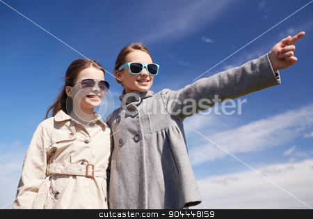 To use this stock image in your creative project, please select the size you need over to the right and click the "Add to Cart" button.
Your downloaded image will come with the Cutcaster watermark removed so don’t worry about the watermark you see on this page. happy little girls hugging and pointing finger stock photo, people, children, friends and friendship concept -happy little girls in sunglasses hugging and pointing finger outdoors by Syda Productions