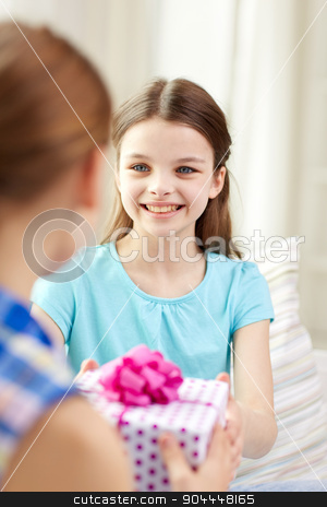 To use this stock image in your creative project, please select the size you need over to the right and click the "Add to Cart" button.
Your downloaded image will come with the Cutcaster watermark removed so don’t worry about the watermark you see on this page. happy little girls with birthday present at home stock photo, people, children, holidays, friends and friendship concept - happy little girls with birthday present sitting on sofa at home by Syda Productions