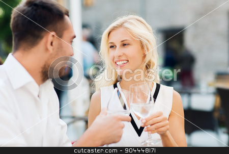 To use this stock image in your creative project, please select the size you need over to the right and click the "Add to Cart" button.
Your downloaded image will come with the Cutcaster watermark removed so don’t worry about the watermark you see on this page. smiling couple drinking champagne at cafe stock photo, love, dating, people and holidays concept - smiling couple wearing sunglasses drinking champagne and looking to each other at cafe by Syda Productions