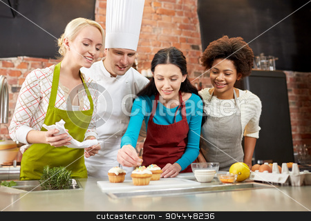 To use this stock image in your creative project, please select the size you need over to the right and click the "Add to Cart" button.
Your downloaded image will come with the Cutcaster watermark removed so don’t worry about the watermark you see on this page. happy women and chef cook baking in kitchen stock photo, cooking class, culinary, bakery, food and people concept - happy group of women and male chef cook baking in kitchen by Syda Productions